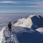 climbing mountain in winter