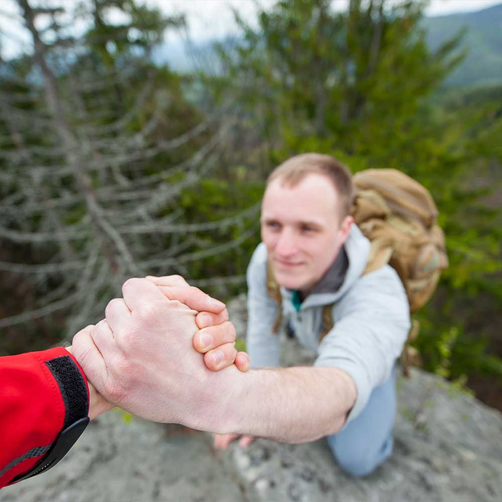Senior executives learning elite navigation and decision-making during mountain leadership challenge