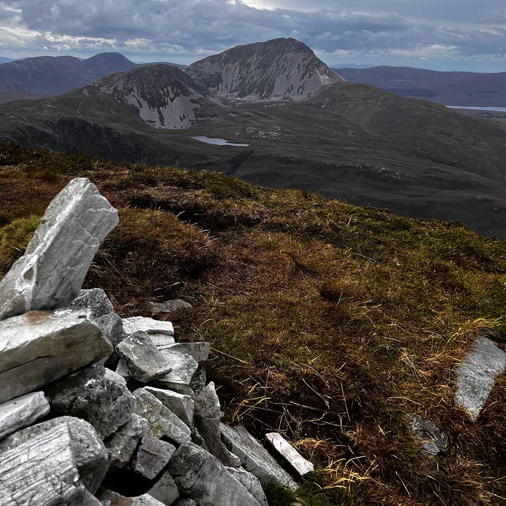 Hiker carefully navigating rocky descent on Carrauntoohil Ireland's highest peak