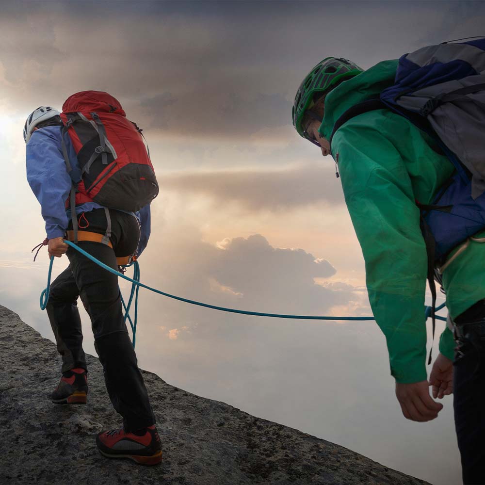 Exhausted climbers on Snowdon summit during Wales 7 Summits Challenge day two