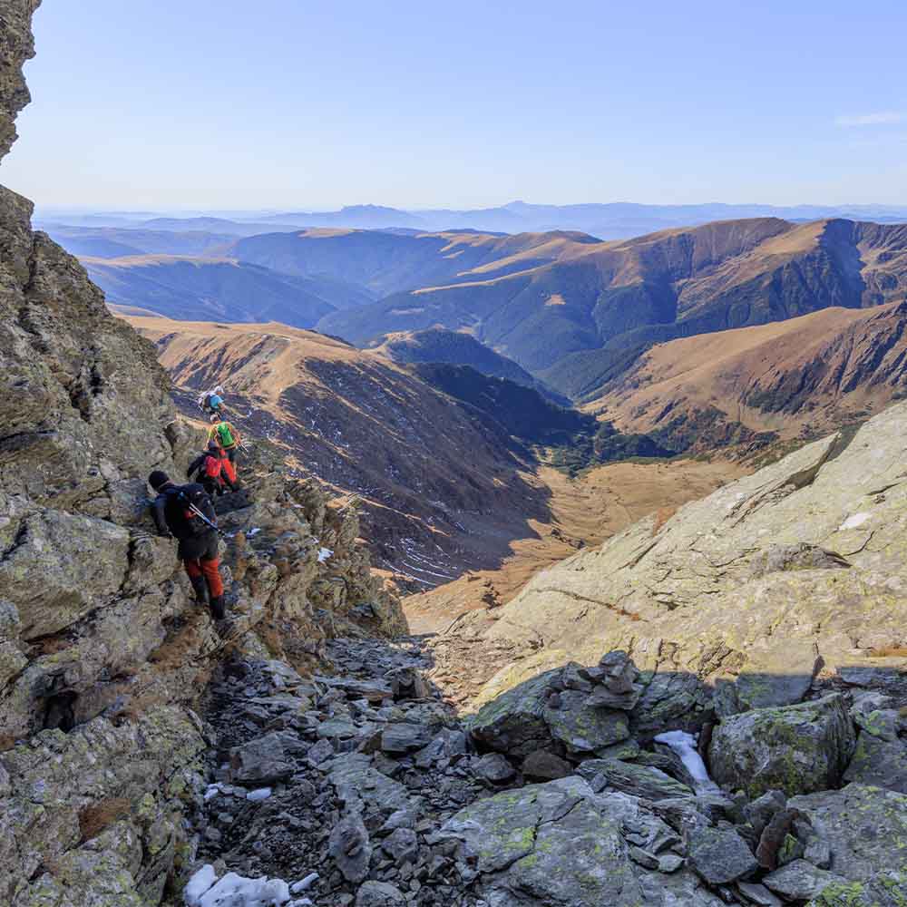 Climber scrambling on Tryfan north ridge Wales 7 Summits mental challenge