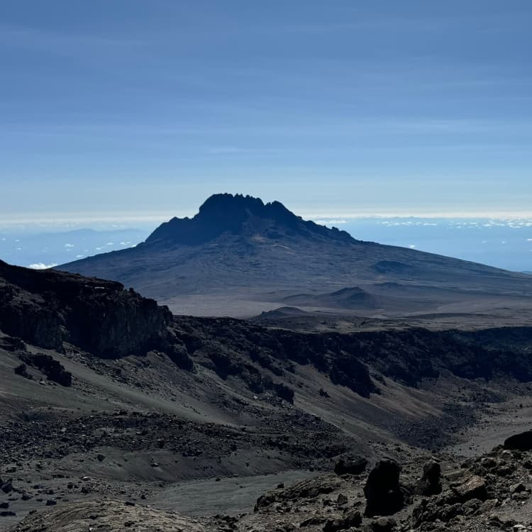Aerial comparison of Kilimanjaro ice cap coverage in 1912 versus present day showing 85 percent loss