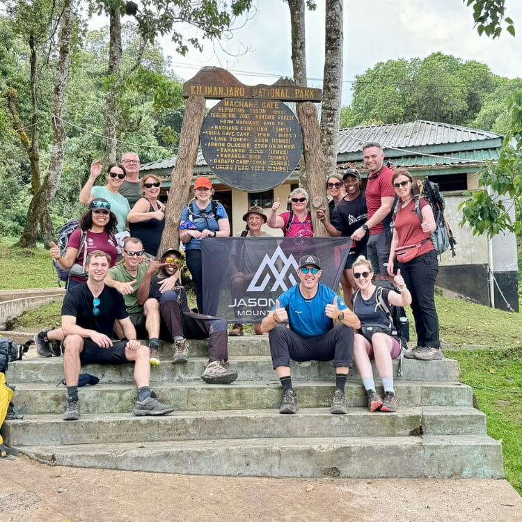 Trekkers entering Machame Gate at 1814 metres at the start of the Kilimanjaro Machame Route expedition