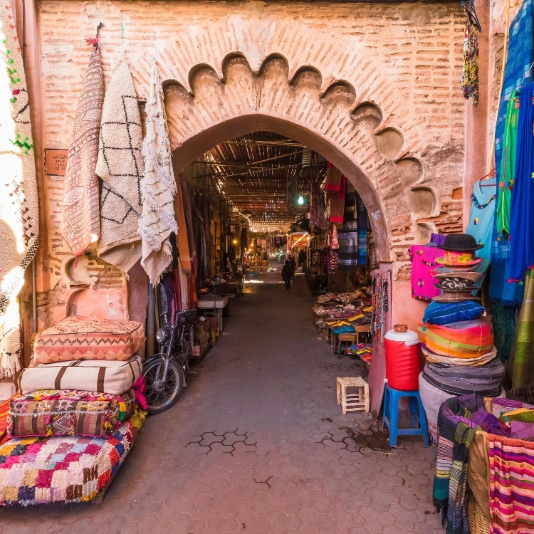 Women travellers exploring the Marrakesh medina and souks at the start of a Mount Toubkal expedition Morocco