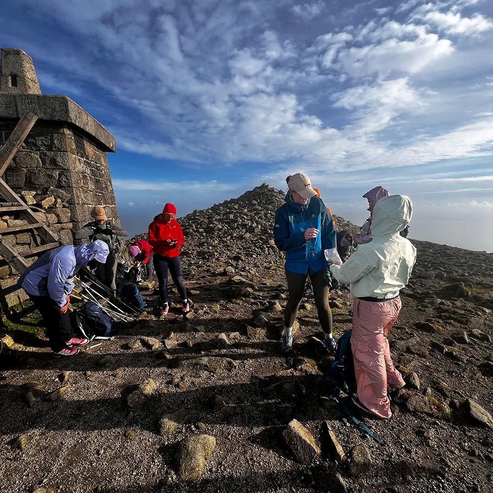 Hiker in waterproof gear on Irish mountain in rain during multi-peak challenge
