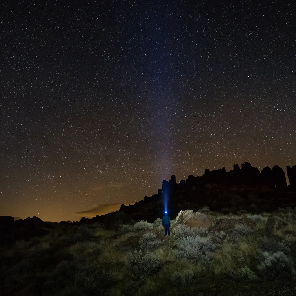 Line of headlamps on frozen scree during midnight summit push on Kilimanjaro above 5000 metres Machame Route