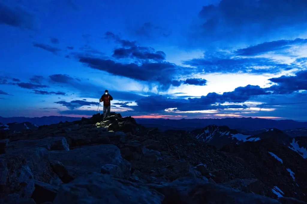 Line of headlamps on frozen scree during midnight summit push above Kosovo Camp on Kilimanjaro Machame Route