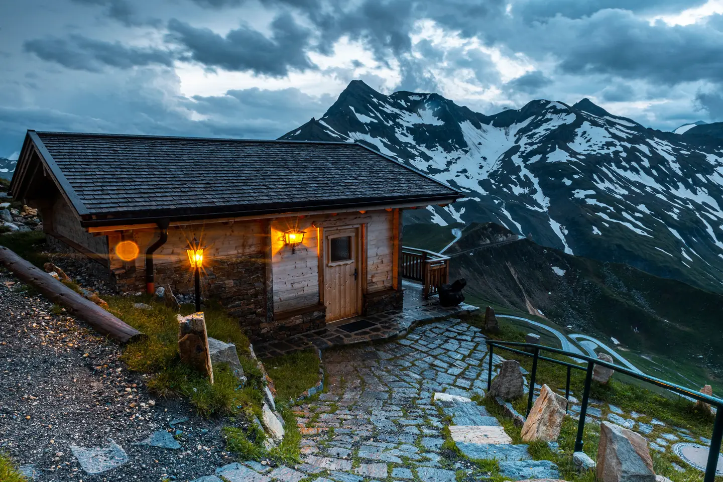 Traditional Bulgarian family-run mountain guesthouse at dusk during hut-to-hut trekking Bulgaria 7 Summits