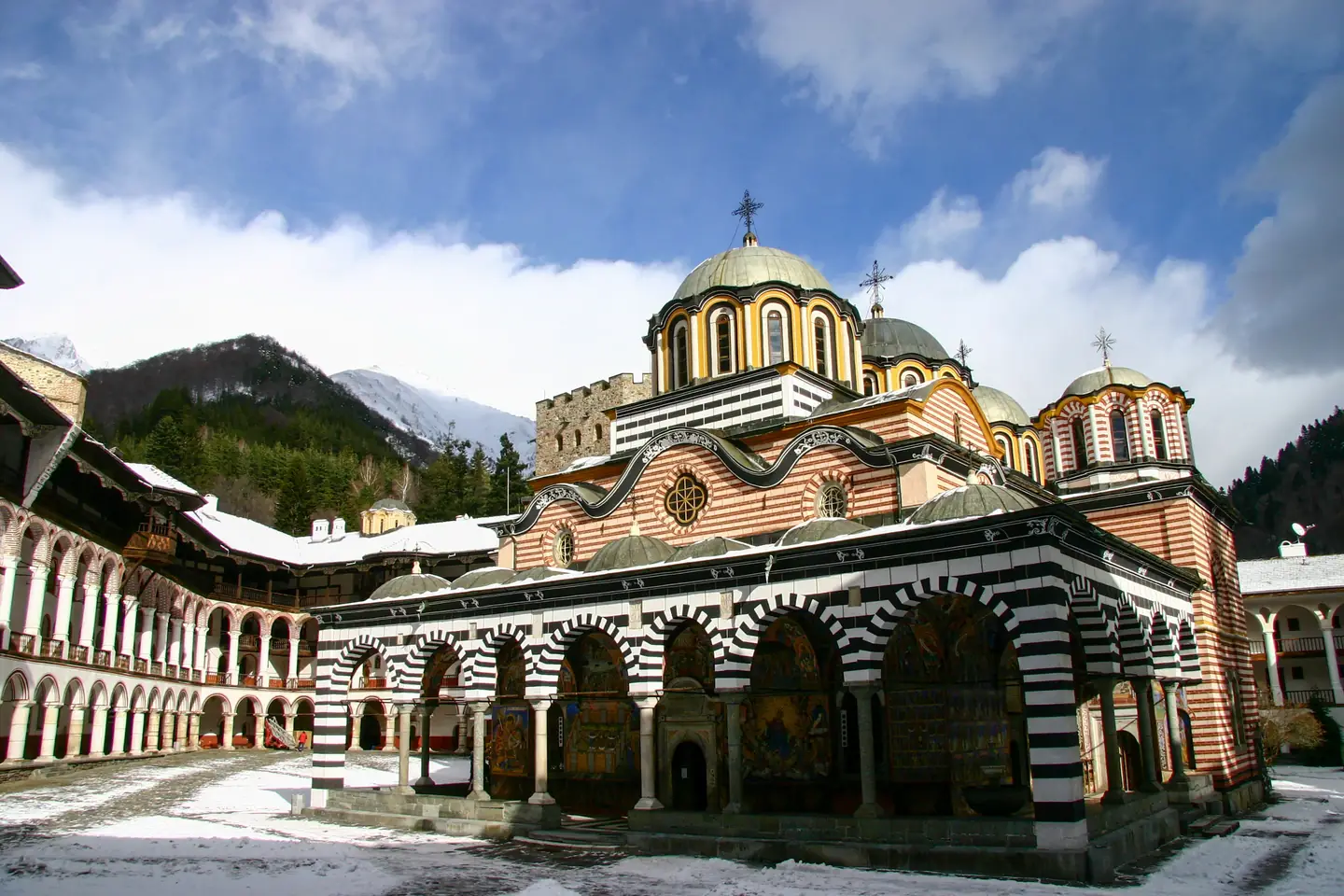 Rila Monastery UNESCO World Heritage Site with mountain backdrop on Bulgaria 7 Summits Day 4 cultural stop
