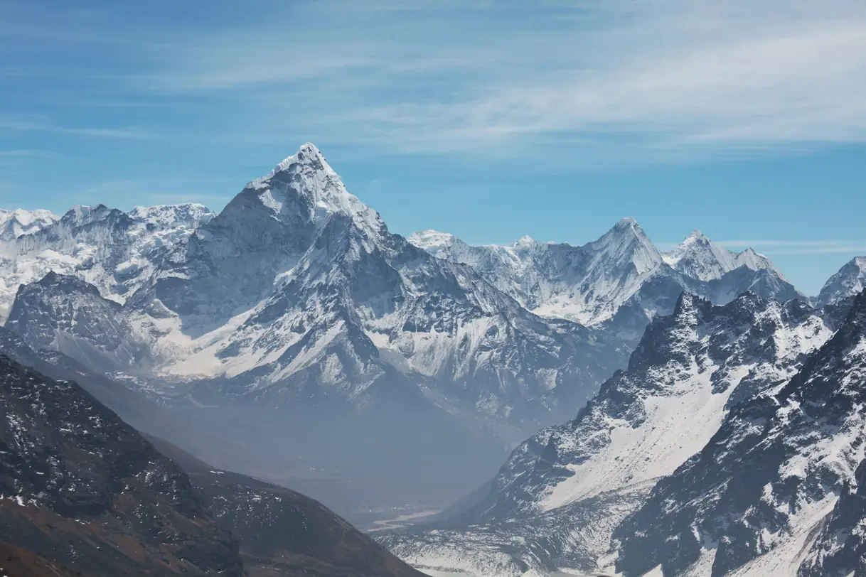 Climber reaching summit of Himlung Himal at 7126m in Nepal's Nar-Phu Valley after 29-day expedition via Southwest Ridge